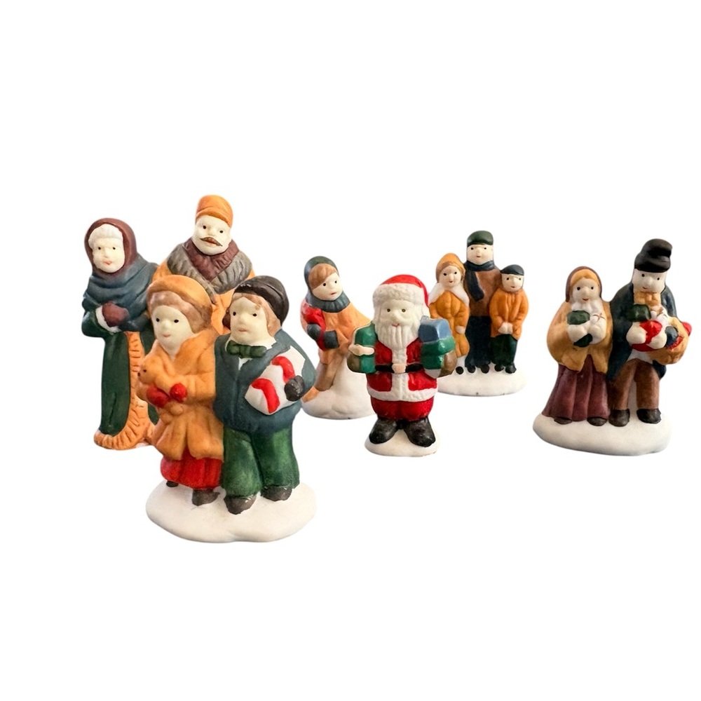 Festive Christmas village porcelain or Ceramic Figurine Set